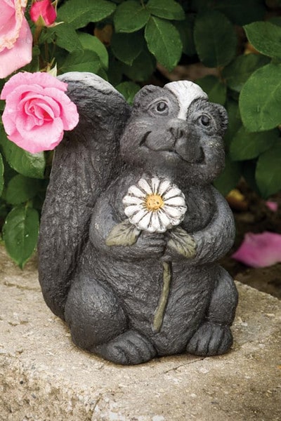 Sweet Faced Garden Skunk Statue holding Daisy Flower Whimsical
