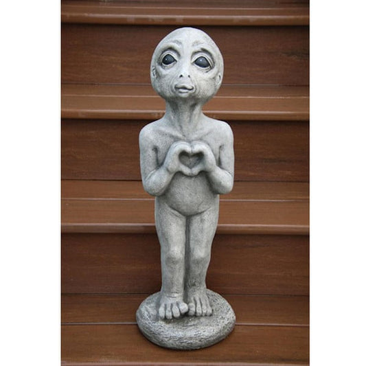 Heart Alien statue featuring an extraterrestrial figure with a hand shaped