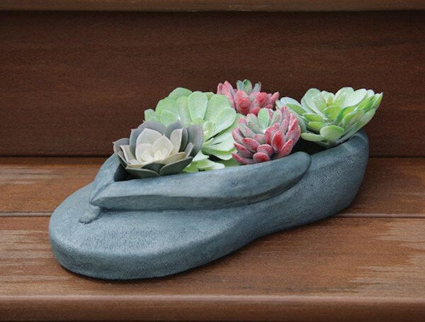 Statue innovative design takes the form of a flip-flop sandal planter garden