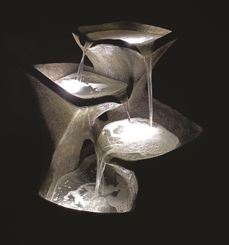 Cascading Pools Fountain is a stunner at night time view of modern sculpture