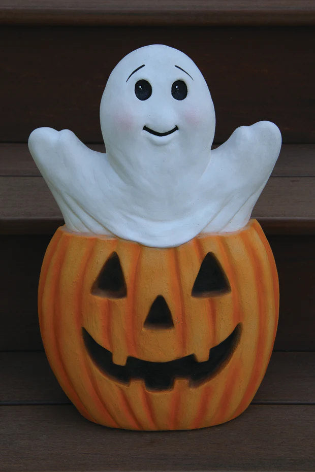 Halloween decoration with ghost on top of a pumpkin garden sculpture made of  Cement