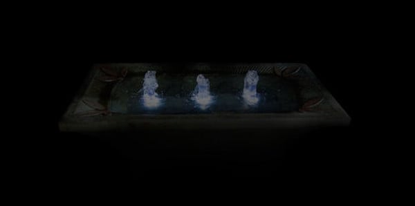 Deco Motif Uniquely Cement Fountain rectangular design florets corners night time view