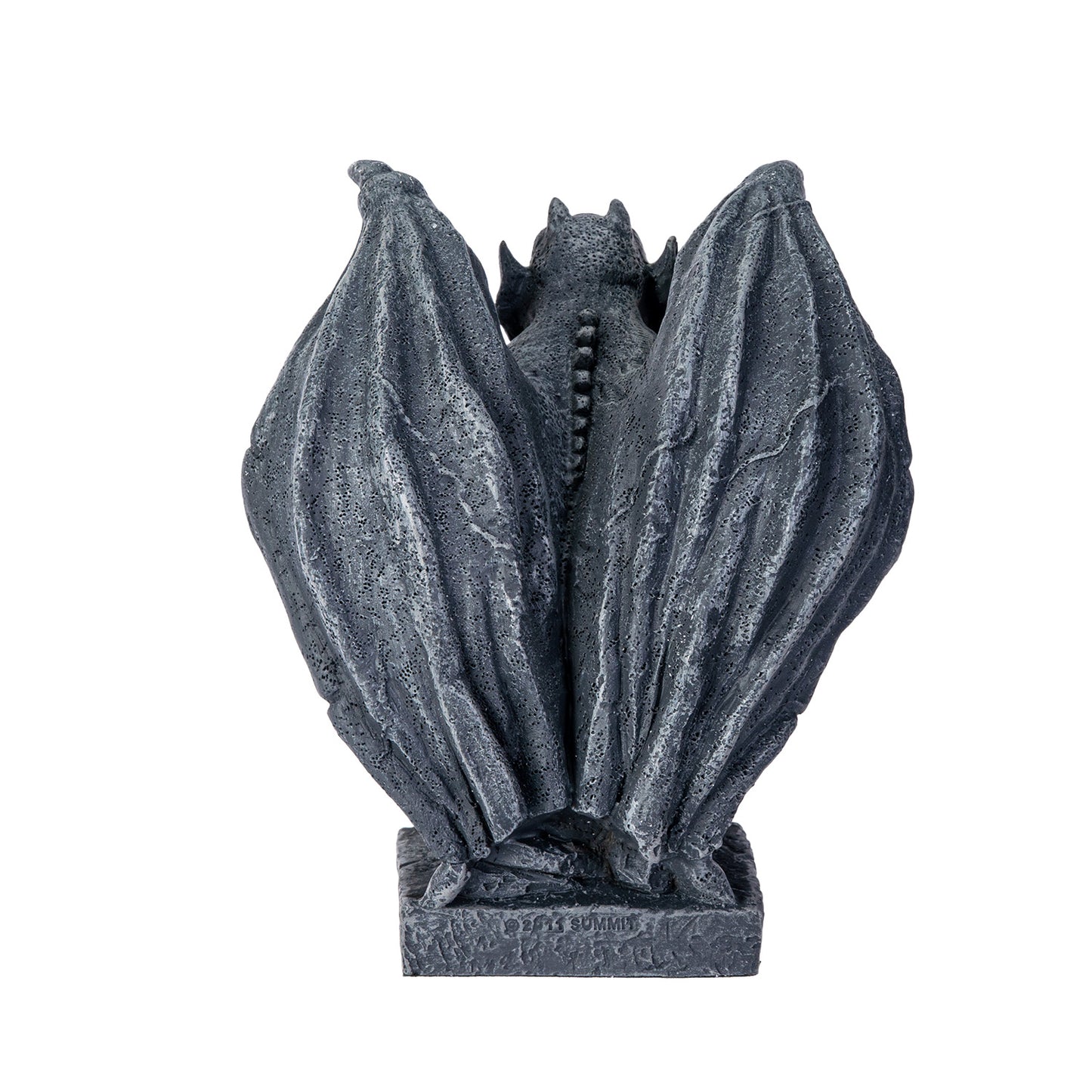Decorative stone gargoyle sculpture on a white background back view of statue