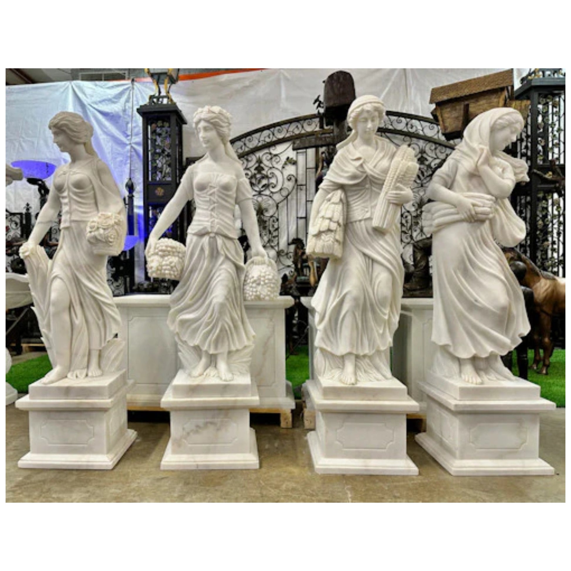 Life-size marble statues representing four seasons