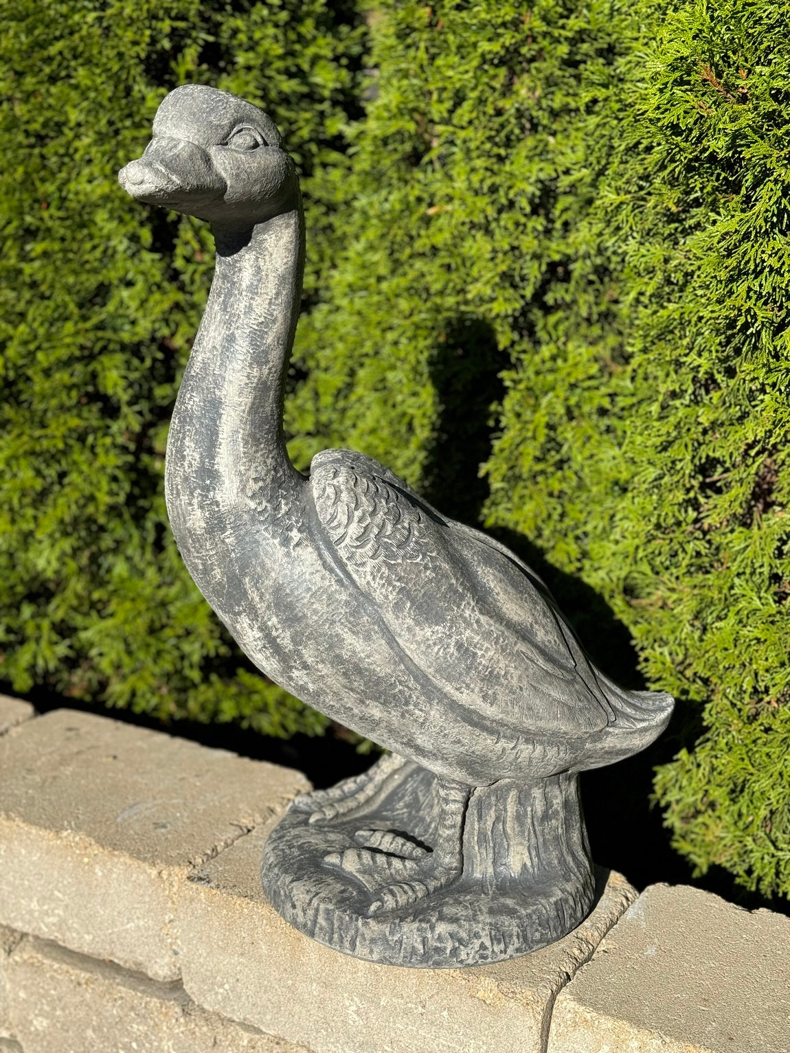 Traditional cast stone goose statue for lakeside or garden setting