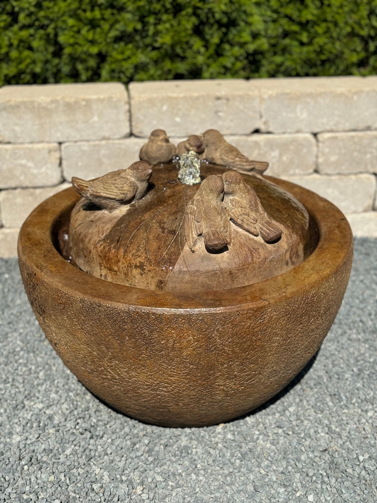 Six birds gathering around fountain top blubber garden sculpture lighted