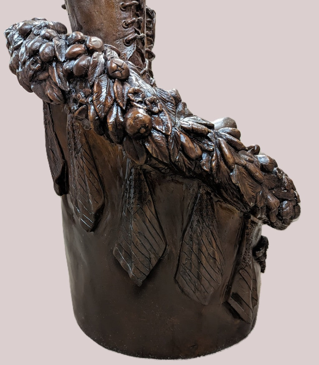 Bronze boot with decorative elements on a pink background Guardian of Freedom Bronze Battle Cross Sculpture