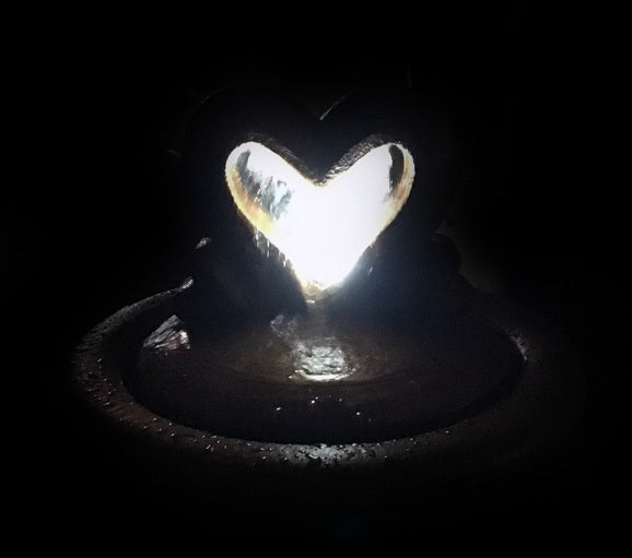 Two Hearts as One garden bubbler fountain with light kit nighttime view