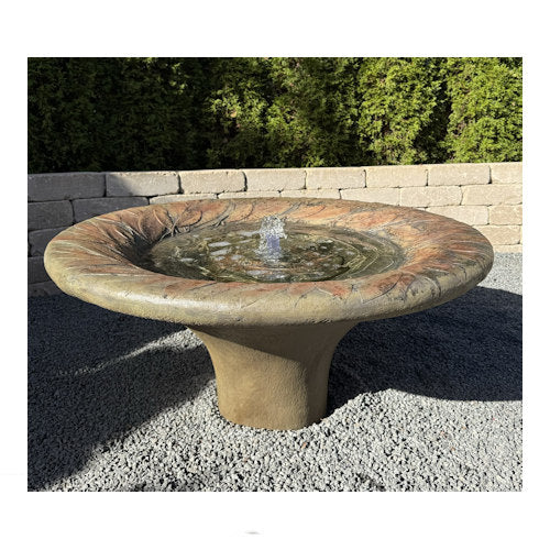Detail of the leaf fountain motif round garden water bubbling sculpture