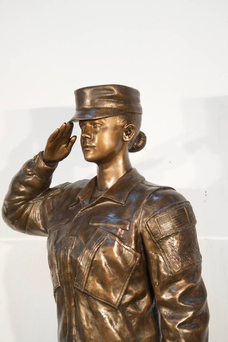 Life-size woman soldier bronze tribute statue for veterans memorial close up