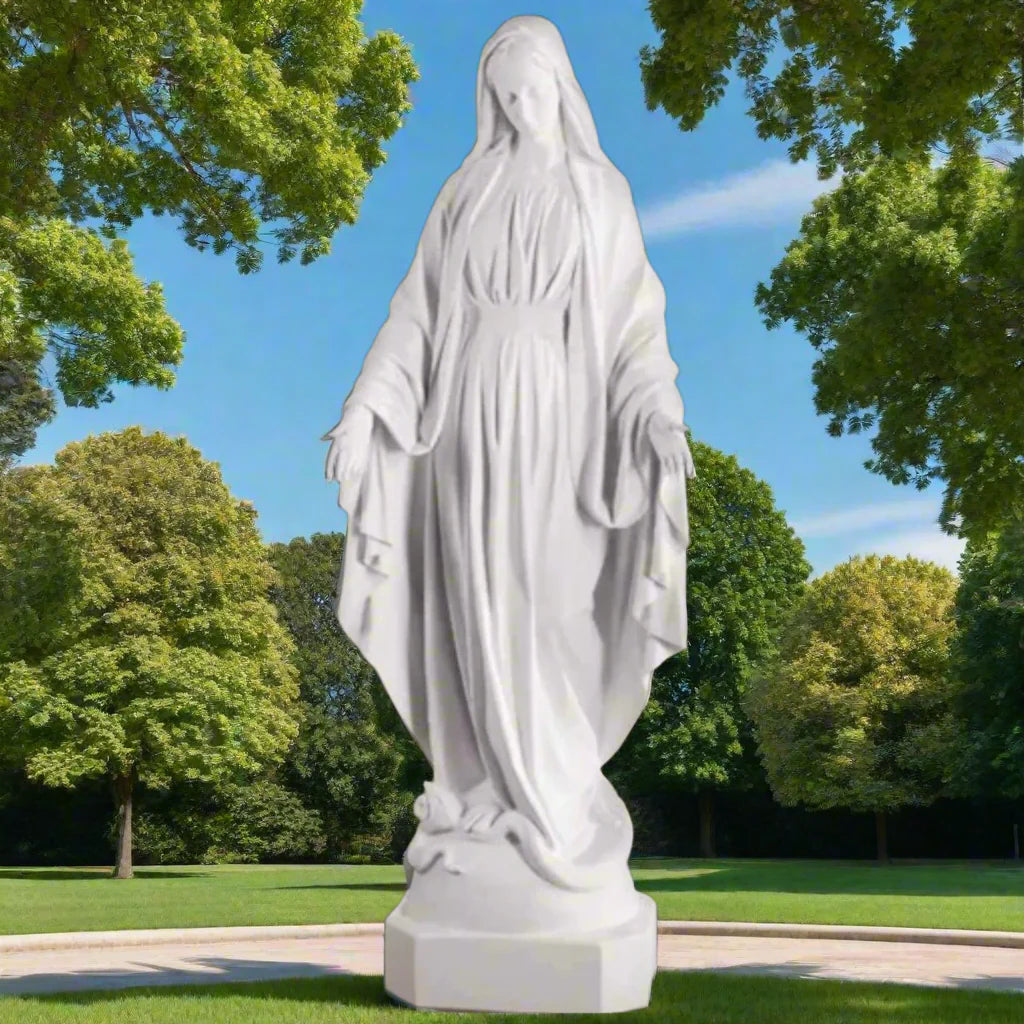 Bonded marble Virgin Mary statue, life-size and serene, shown outdoors with flowers and greenery surrounding a memorial-style base