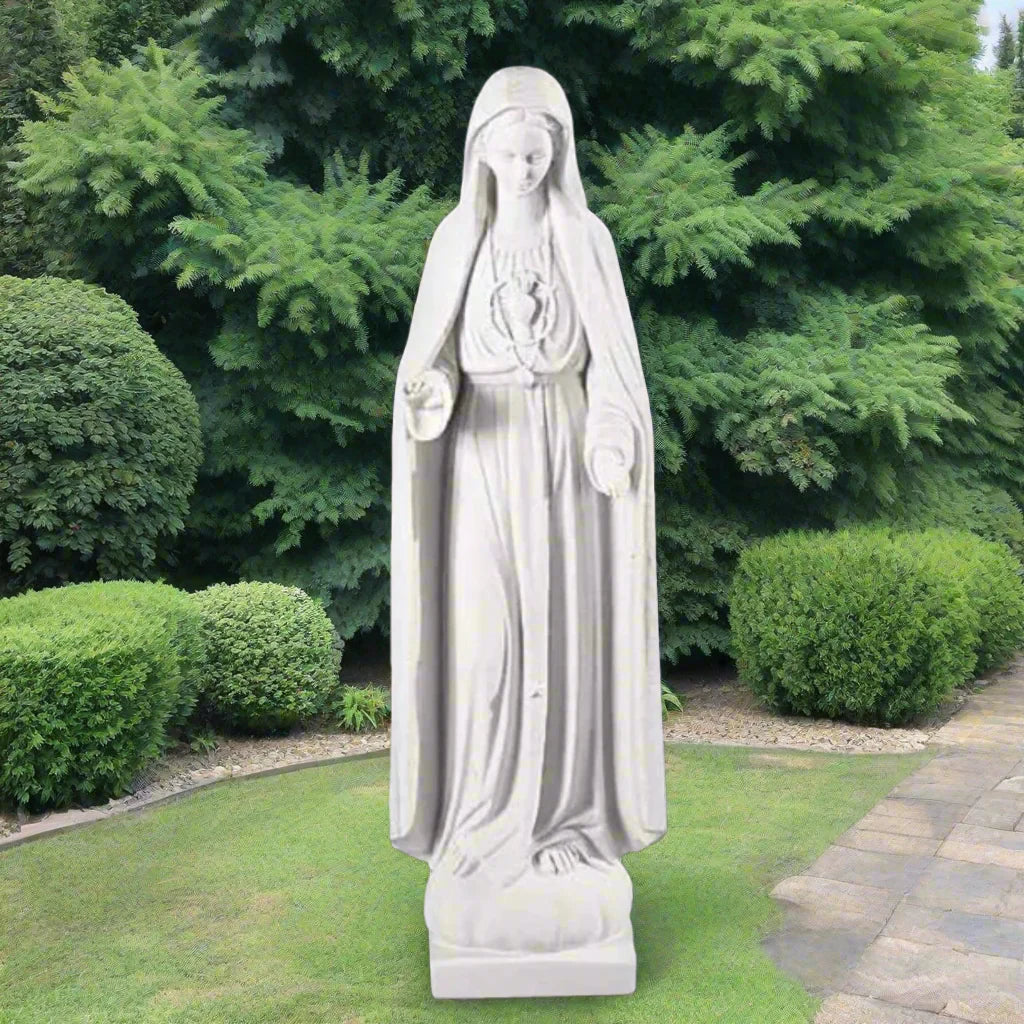 37.5-inch Italian marble Our Lady of Fatima statue, displayed in a landscaped prayer garden with flowers and soft natural surroundings