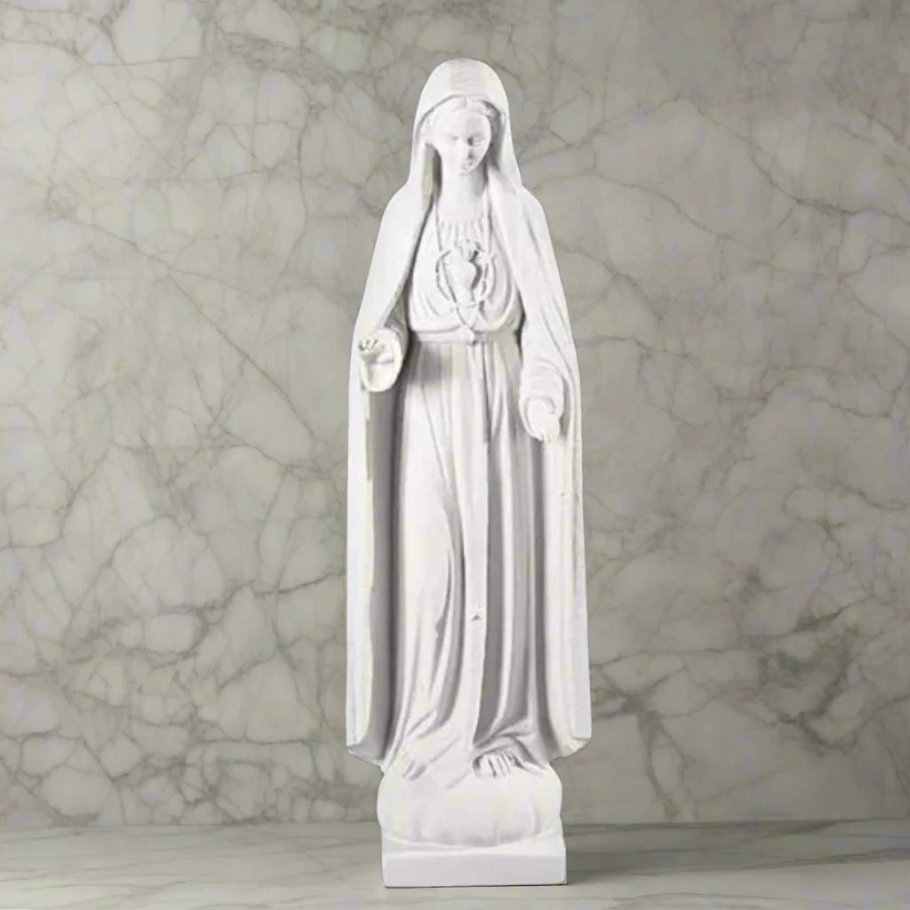 37.5-inch Italian marble Our Lady of Fatima statue, displayed in a landscaped prayer garden with flowers and soft natural surroundings