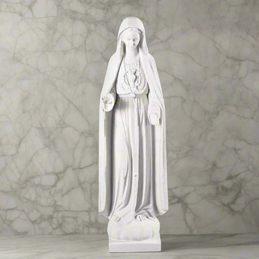37.5-inch Italian marble Our Lady of Fatima statue, displayed in a landscaped prayer garden with flowers and soft natural surroundings