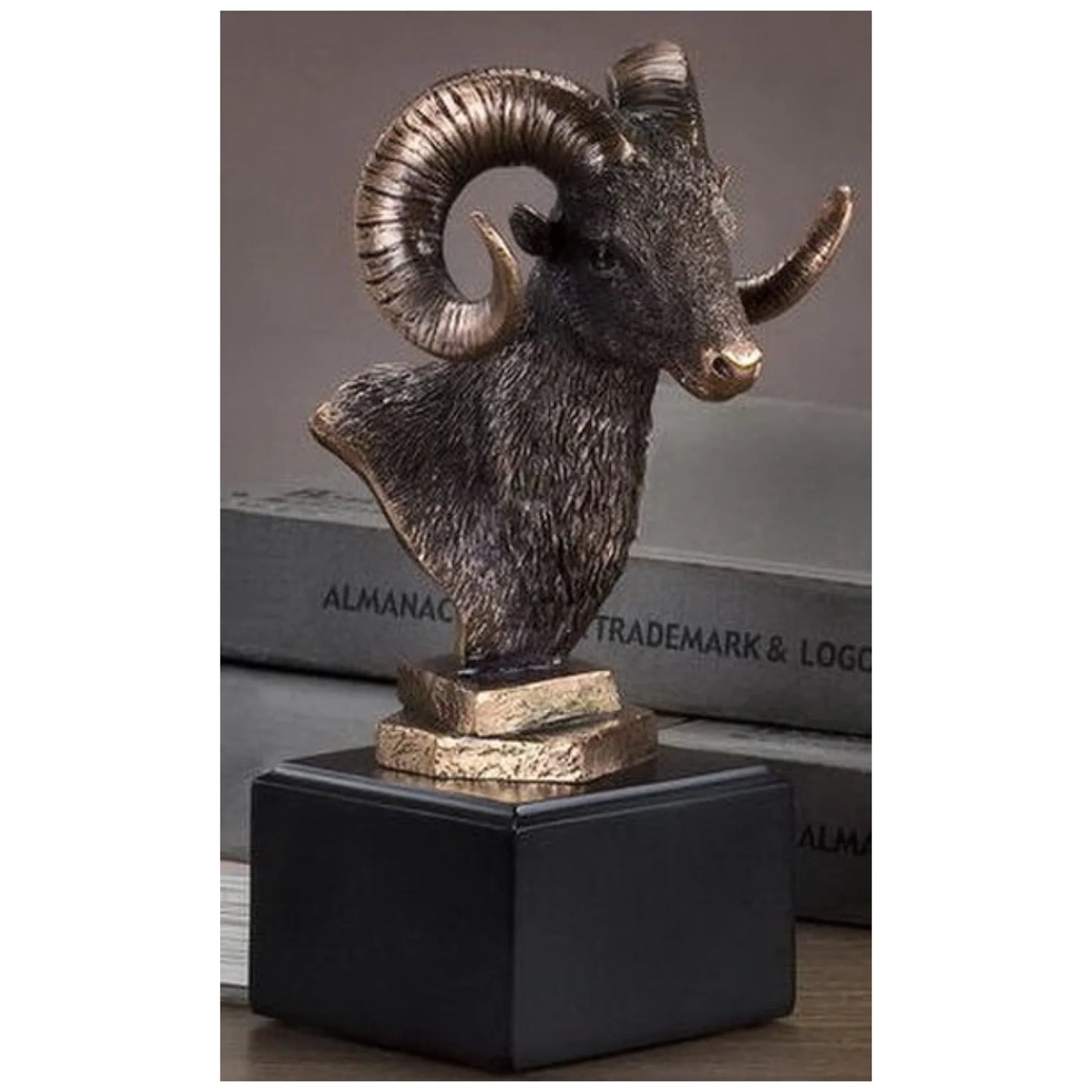 Bronze patina ram head bust on a square base, designed as a hunting award.