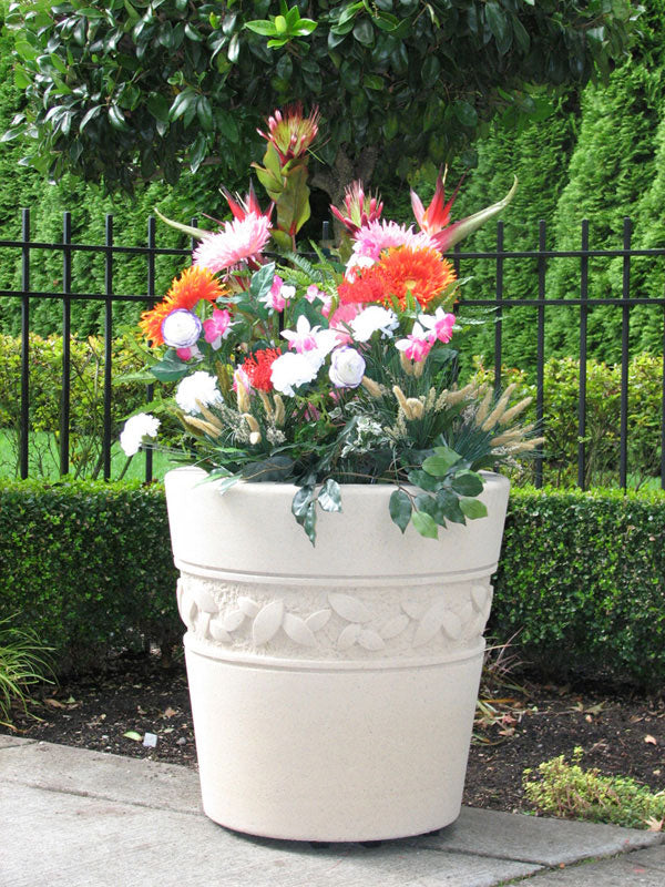 Large round garden planter with decorative leaf band