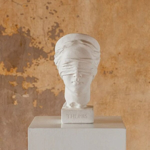 In Greek mythology Themis is the goddess of justice bust statue blindfolded