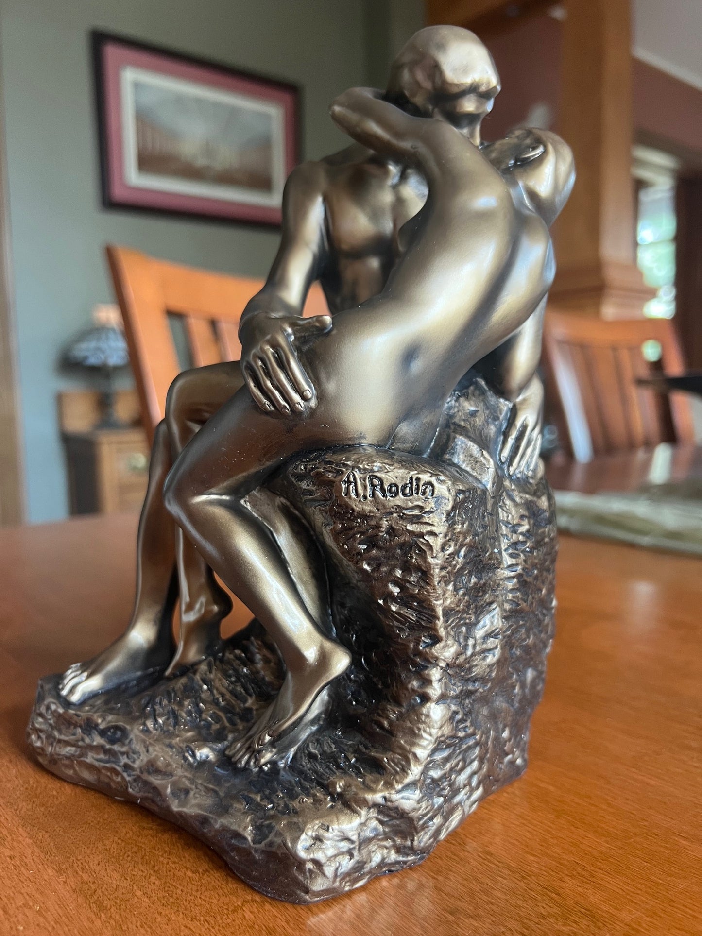 The Kiss by August Rodin Statue replica finished in a bronze color