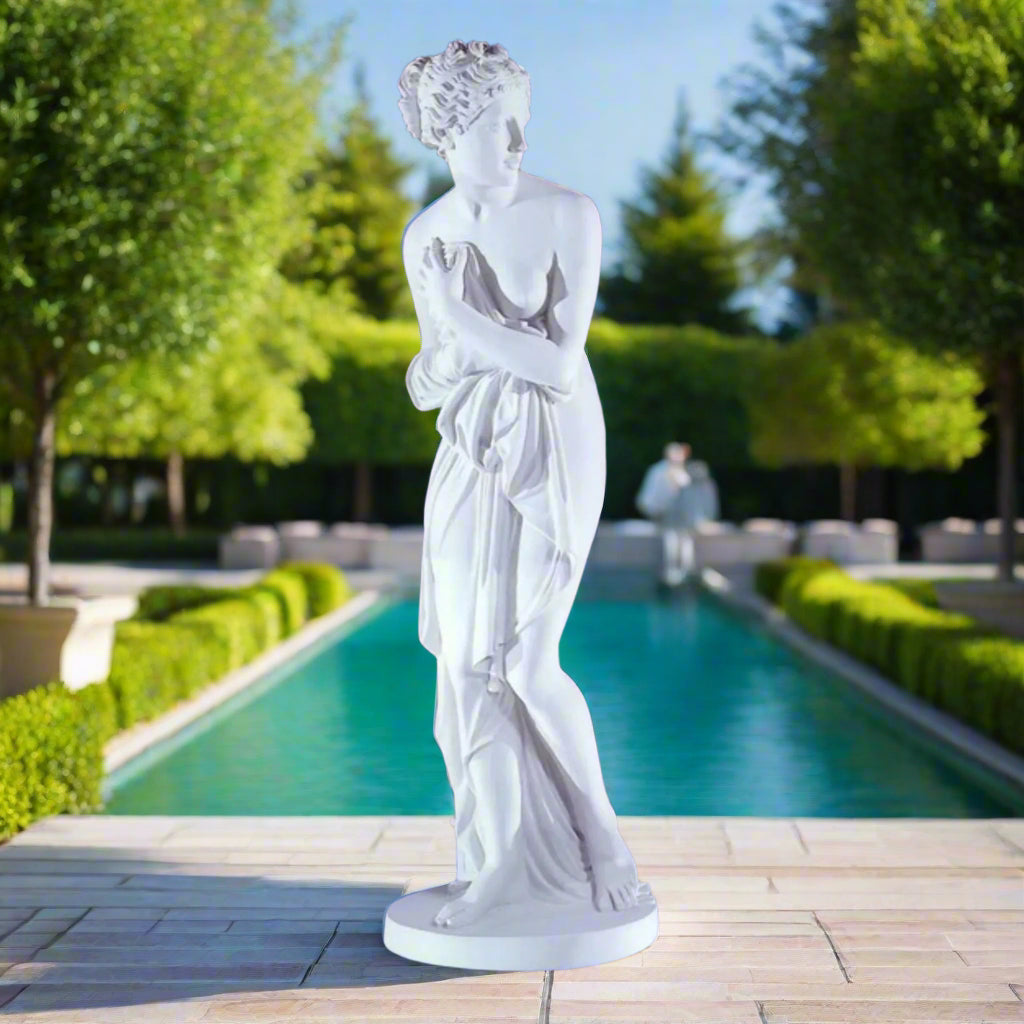 Italian neoclassical marble sculpture of Venus outdoor at a luxury pool on a sunny day.