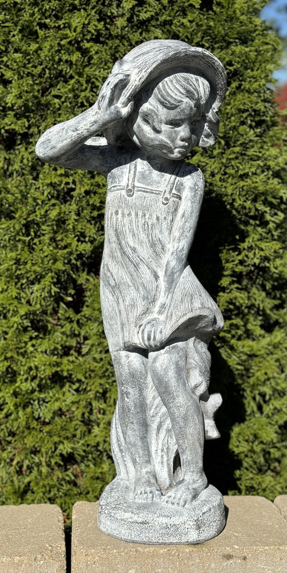 Windy Kerrigan Girl Holding Hat Statue Outdoor garden sculpture