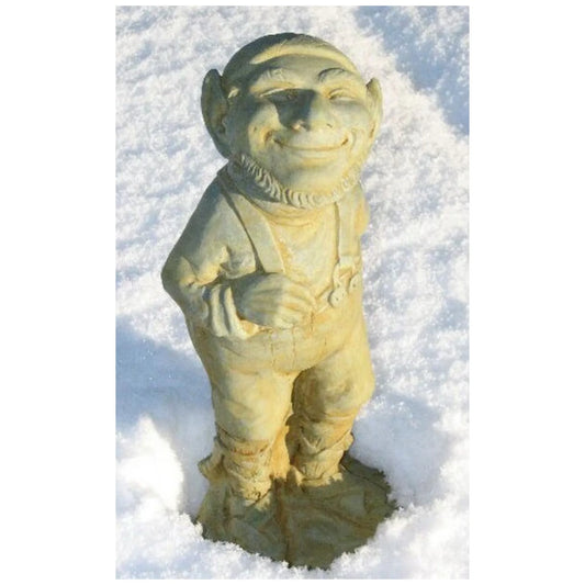 Smiling Winter Elf Sculpture standing in the snow.