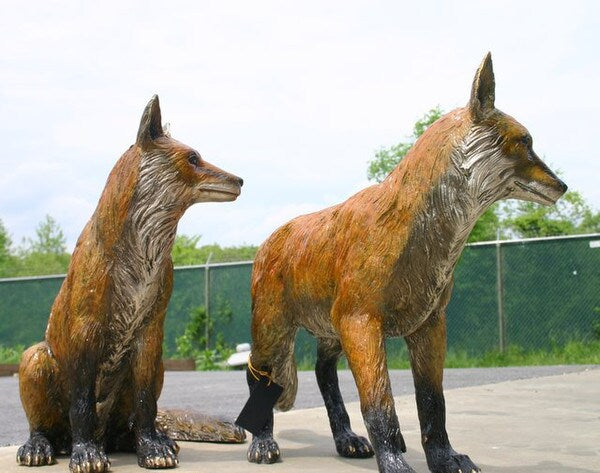 Fox sculptures image showcases two natural wildlife statues set pair
