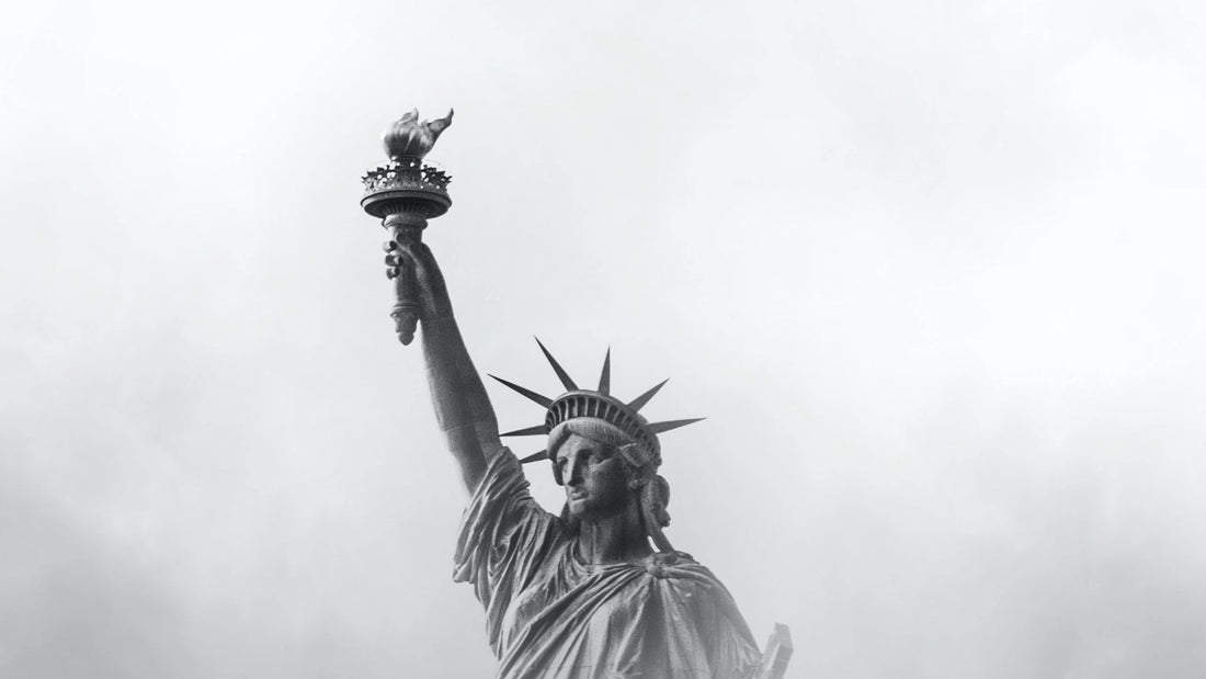 The Statue of Liberty, on a cloudy day, shiny through the clouds, American Patriotism.