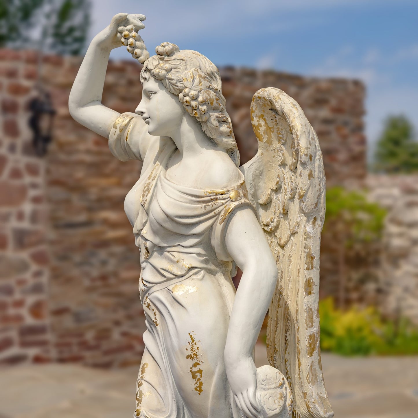 side view Angel of the Harvest Life-Size Garden Sculpture with Grapes and Fruit Basket Estate Sized