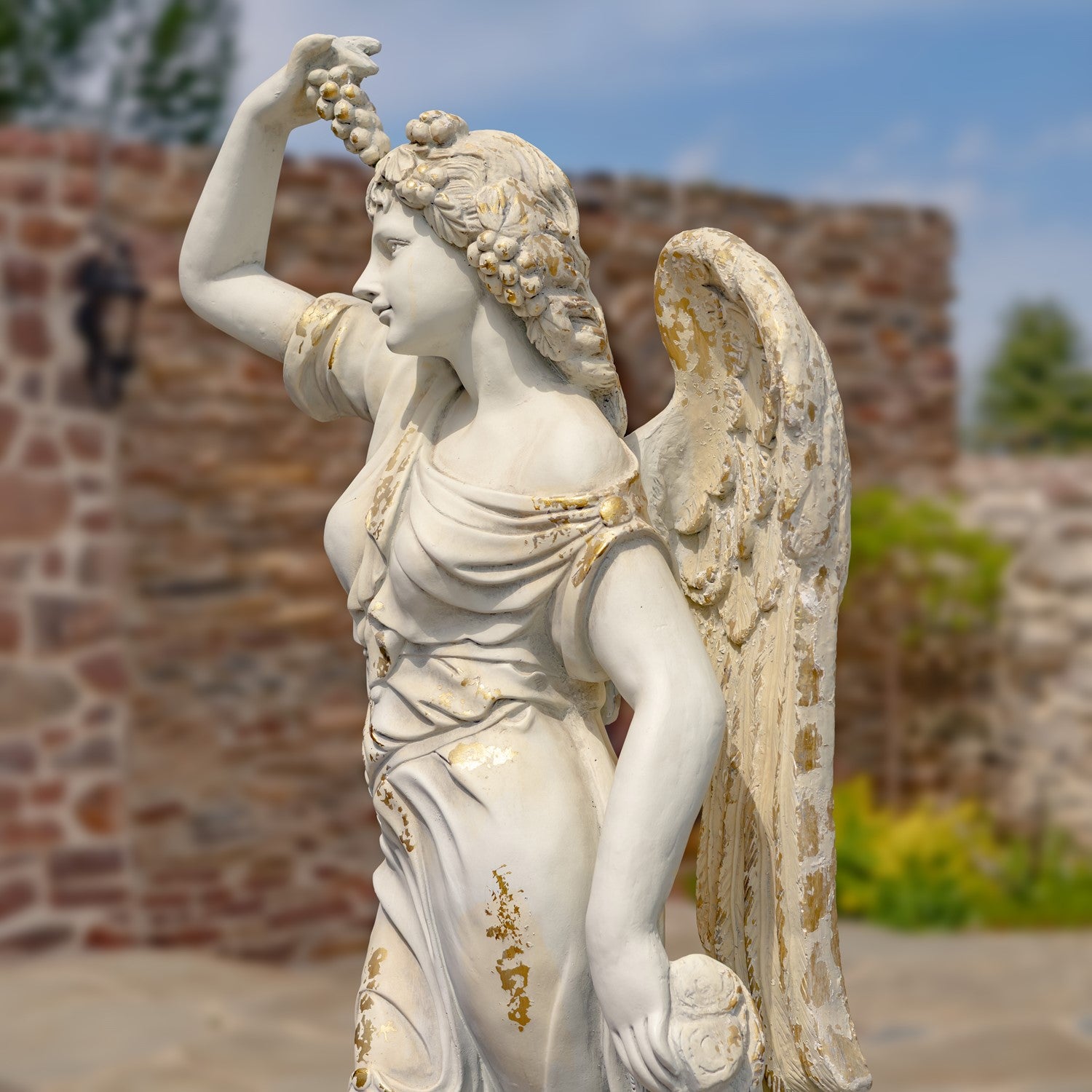 side view Angel of the Harvest Life-Size Garden Sculpture with Grapes and Fruit Basket Estate Sized