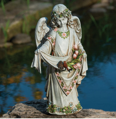 Beautifully detailed Young Angel garden statue with a bouquet of flowers and a couple of birds sitting in the folds of her gown