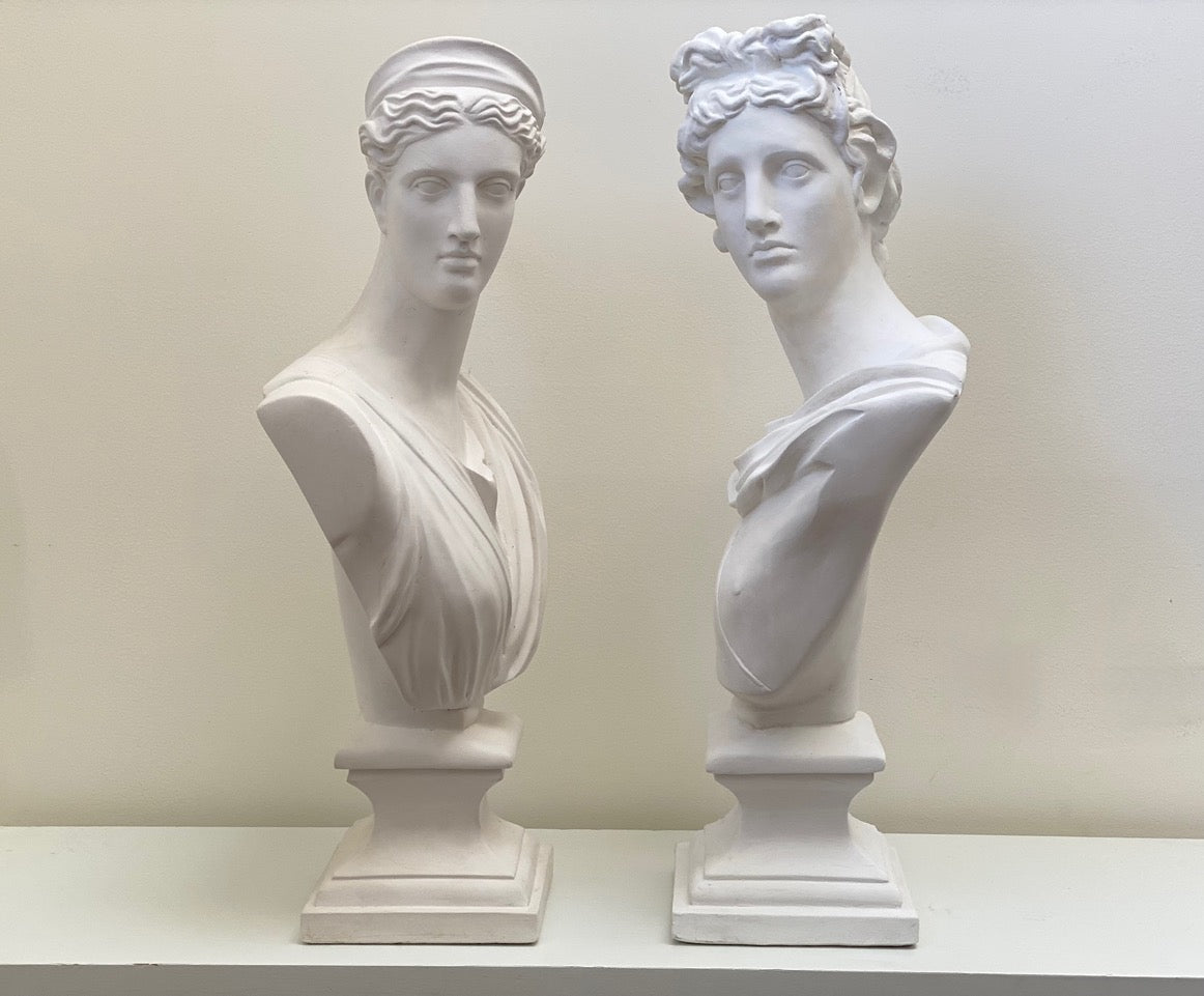 Apollo and Diana bust view of them sideways of both sculptures made of plaster