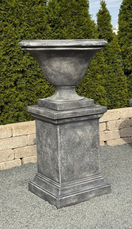 Avanti bow planter paired with the Pedestal creating a striking focal point