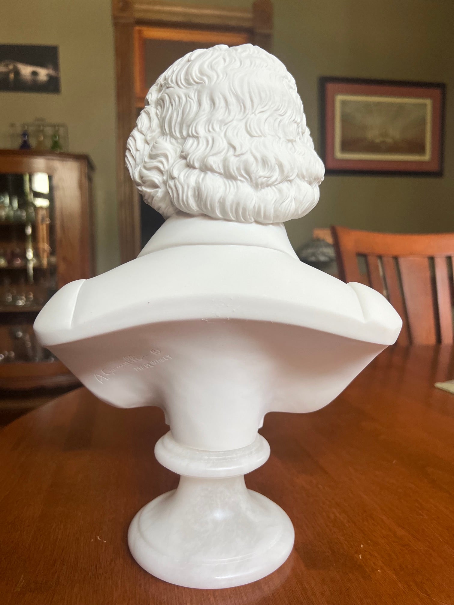 Back view of Ludwig van Beethoven collectible statue on pedestal base