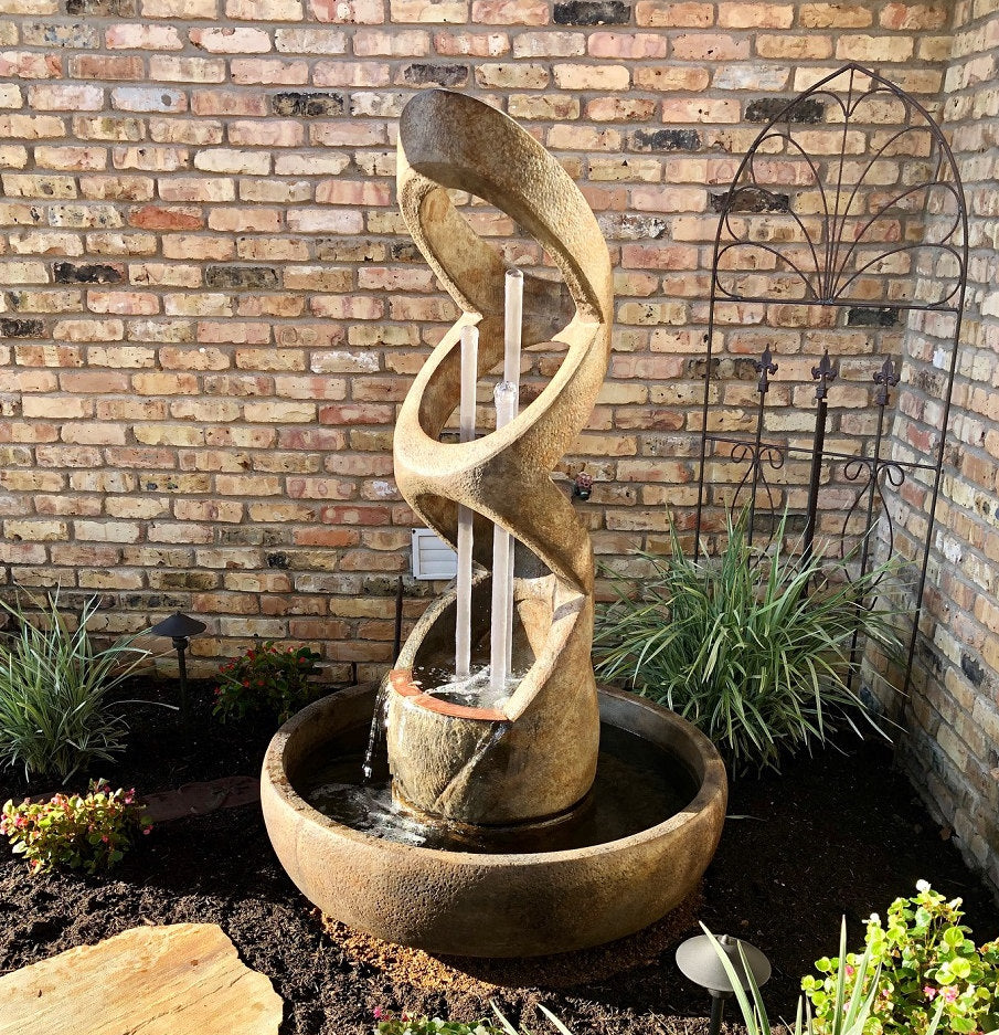 Balancing Rings Modern Fountain with Clear Pipes is a bold sculptural water feature designed to bring contemporary artistry