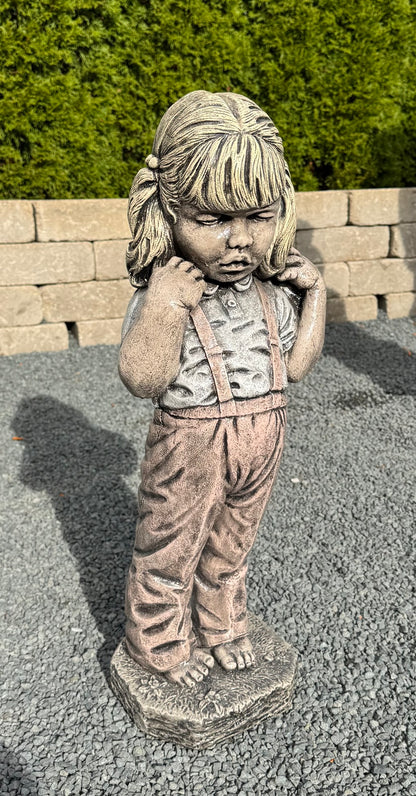 Bashful girl garden statue capturing childhood innocence with ponytails and shy pose