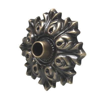 Decorative brass fitting on a white background water spout decorative emitter