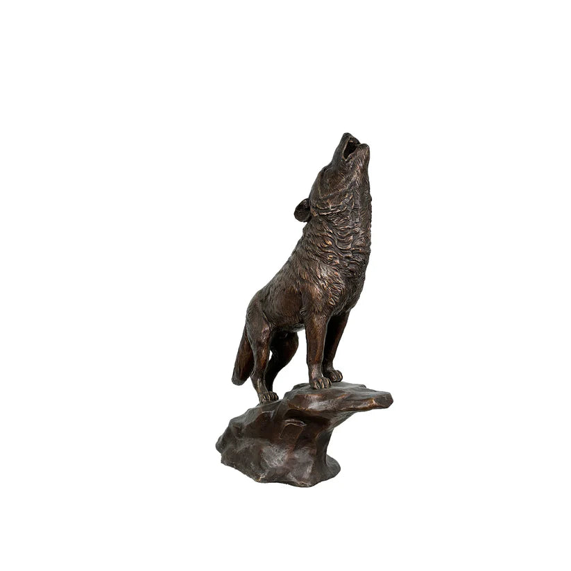 Bronze statue of a howling wolf on a white background