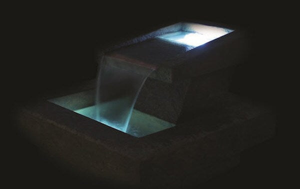 Phoenix cement fountain with led lighting shimmering night time effect