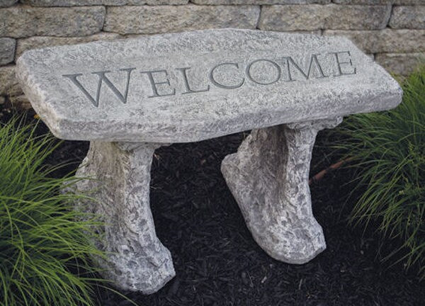 Stone Welcome Bench that has the words carved Cement Garden Art