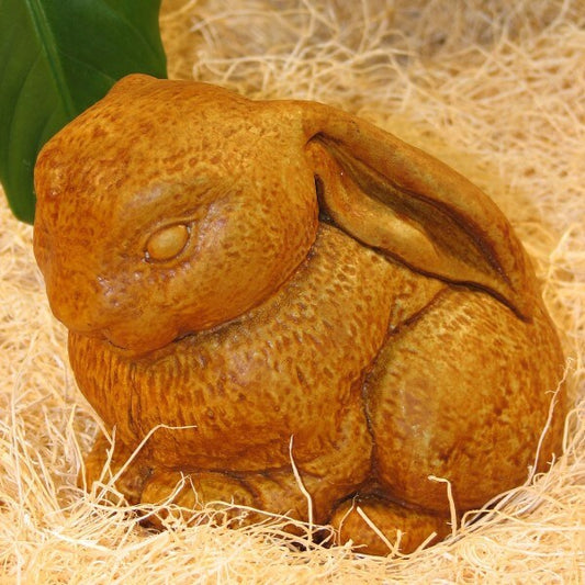 Stone Bunny Statue - A lop eared rabbit rests with ears down