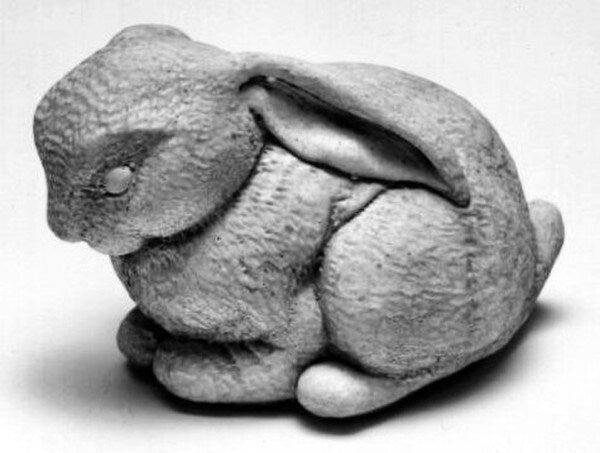 Stone Bunny Statue - A lop eared rabbit rests with ears down