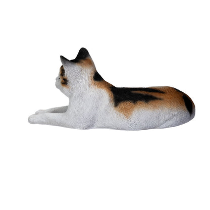 Top view of statue Life like calico cat sculpture lying down with realistic details