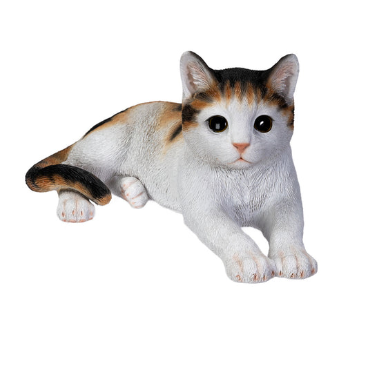 Life like calico cat sculpture lying down with realistic details
