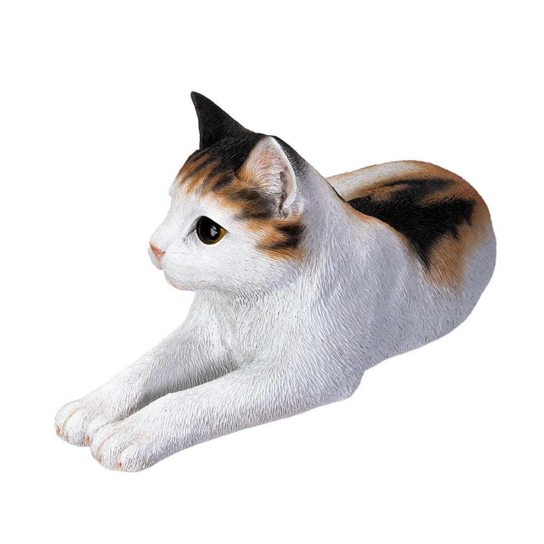 Side view Life like calico cat sculpture lying down with realistic details