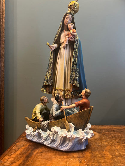 Our Lady of Charity of the Sea Statue the people in boat sculpture