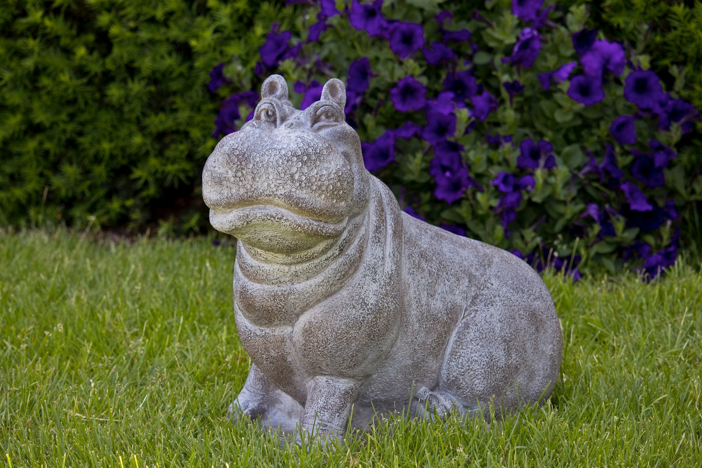 Smiling hippopotamus outdoor sculpture with detailed face