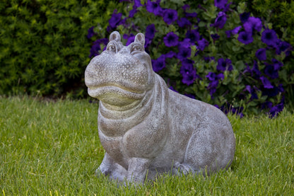 Smiling hippopotamus outdoor sculpture with detailed face