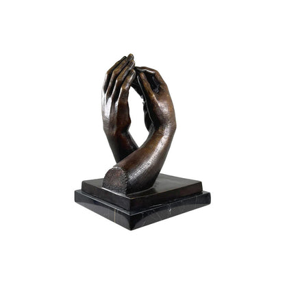 Symbolic bronze hands sculpture by Auguste Rodin mounted on black marble base