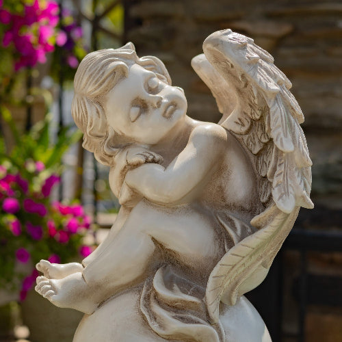 Tall Cherubs Sitting on Globe Pedestals adds a touch of classical elegance to any posts of gates