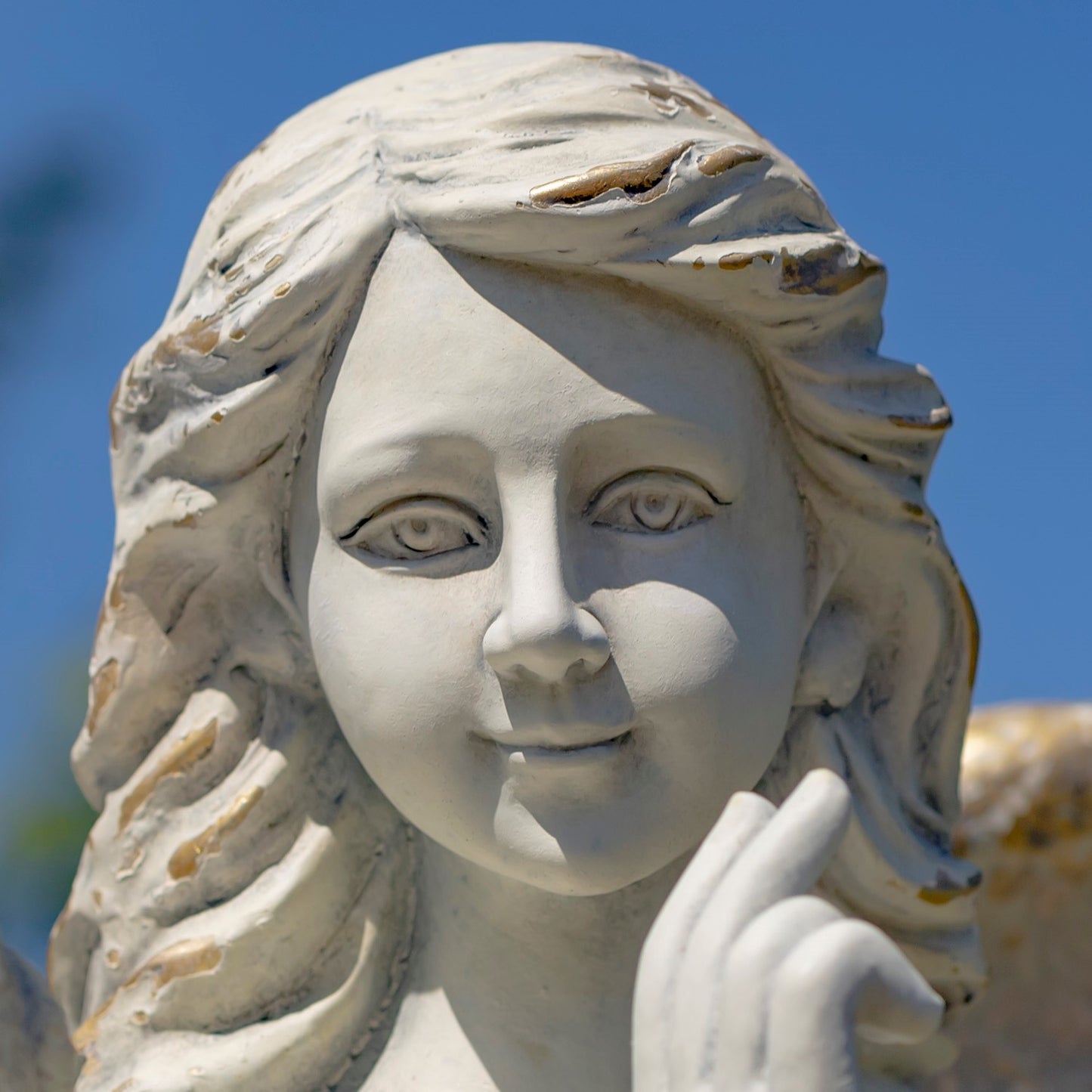 Close up of face Large scale memorial angel garden statue antique white